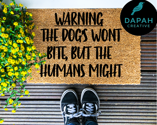 Warning, dogs won't bite, but the humans might Doormat