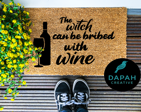 The witch can be bribed with wine Doormat